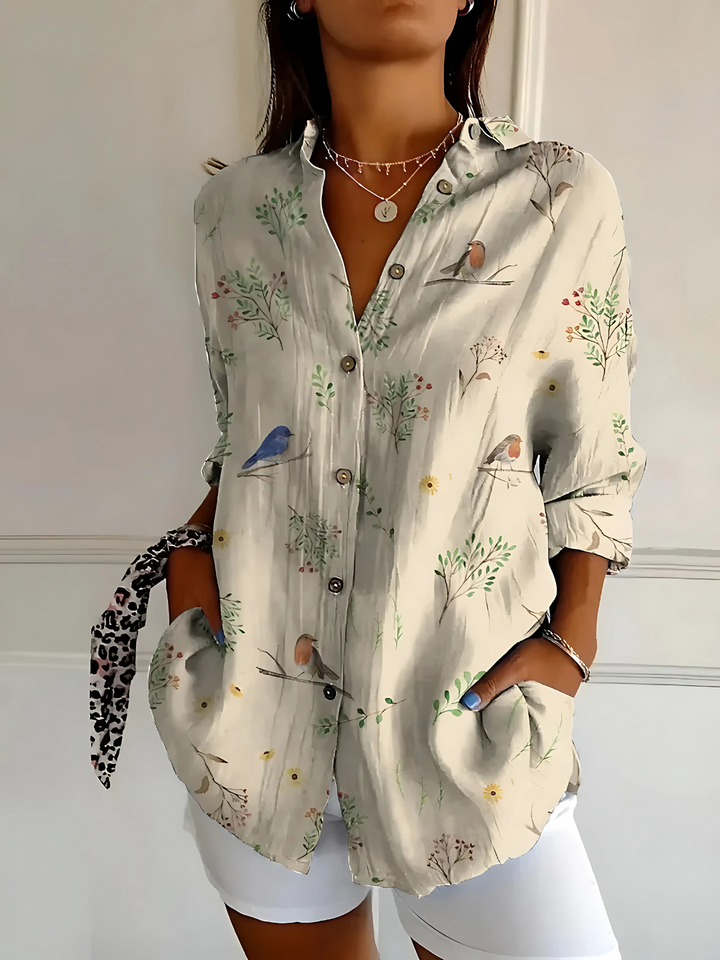 Viana | Blus med blommande vågor